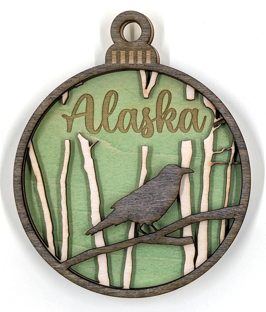 Alaska Christmas ornament, raven with green background